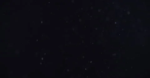 snow lookalike particles falling over bl... | Stock Video | Pond5