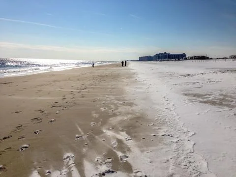 Snow lying on a sandy beach in winter 写真素材