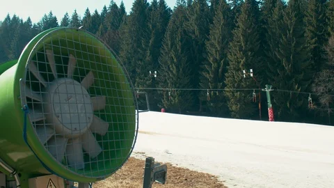 Snow machine next to an empty ski resort in the spring. Shot on RED Raven Stock Footage 105746355