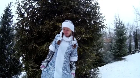 Snow Maiden in forest smiling dancing in front of pine tree Stock Footage 71015951
