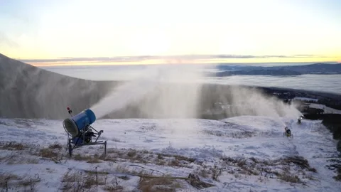 Snow making machine on piste at ski resort in snowy country. Stock Footage 146141591
