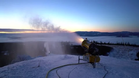 Snow making machine on piste at ski resort in snowy country. Stock Footage 146141594