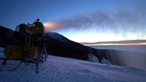 Snow making machine on piste at ski resort in snowy country. Video stock 146141602