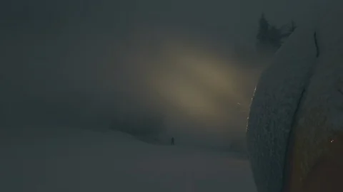 Snow making machine on ski slope at night Stock Footage 100416987