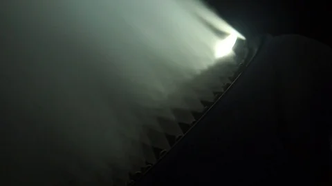 Snow making system. A snow cannon sprays water and makes snow. At night, macro Stock Footage 124277553