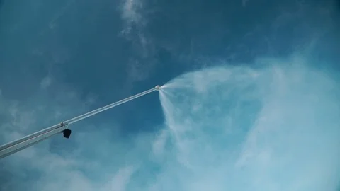 Snow making system. A snow cannon sprays water and makes snow. At night, the Stock Footage 124277624