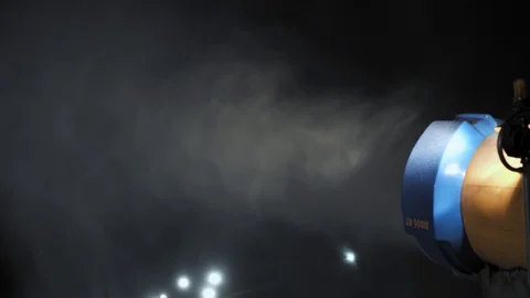 Snow making system in work at night. Snow cannon Stock Footage 97795267