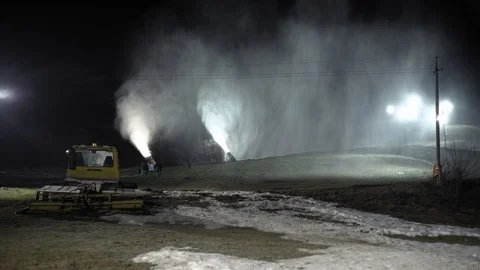 Snow making system in work. Several snow machines produce snow at night. Stock Footage 97283018
