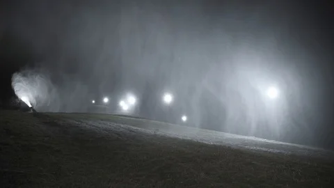 Snow making system in work. Several snow machines produce snow at night. Stock-Footage 97283948