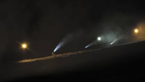Snow making system in work. Several snow machines produce snow at night. Vídeos de archivo 97284233