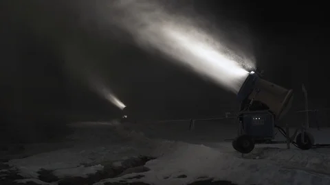 Snow making system in work. Several snow machines produce snow at night. Video stock 97284343