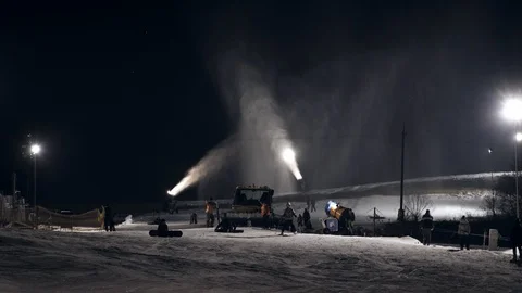Snow making system in work. Several snow machines produce snow at night. Stock-Footage 97798176
