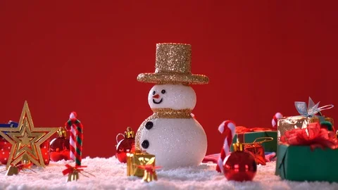 Snow man and gift box decoration on snow background. Stock Footage 94394053