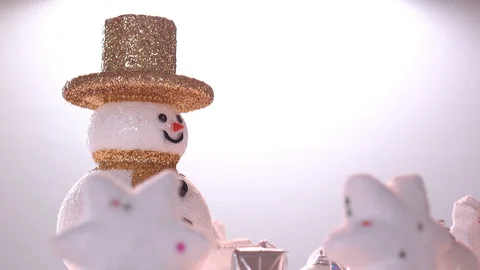 Snow man and gift box decoration on snow background. Stock Footage 94508802