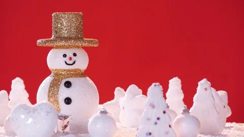 Snow man and gift box decoration on snow background. Stock Footage 94509178