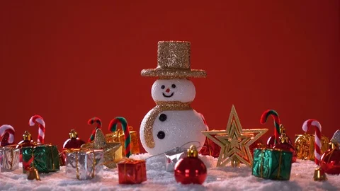 Snow man and gift box decoration on snow background. Stock Footage 94520896