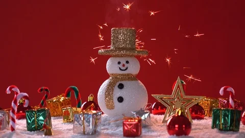 Snow man and gift box decoration on snow background. Stock Footage 94521995