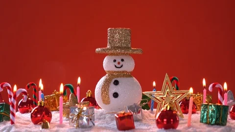 Snow man and gift box decoration on snow background. Stock Footage 94656342