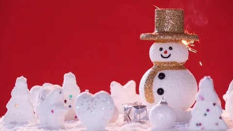 Snow man and gift box decoration on snow background. Stock Footage 94663376