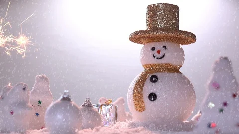 Snow man and gift box decoration on snow background. Stock Footage 94665076