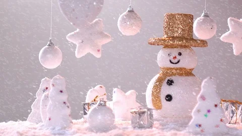 Snow man and gift box decoration on snow background. Stock Footage 94669357