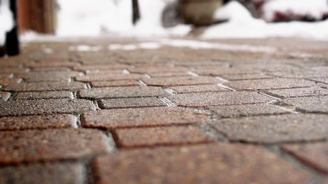 Snow Melting on Brick Sidewalk Stock Footage 85571805