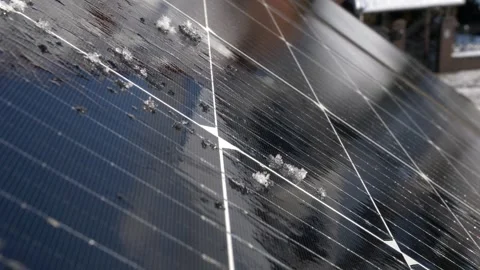 Snow Melting on PV Solar Panels Located on Private House Roof on Sunny Day Stock Footage 259184834