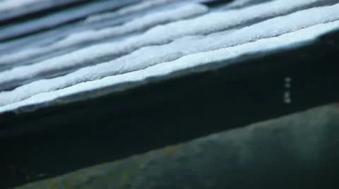 Snow Melting on a Roof Stock Footage