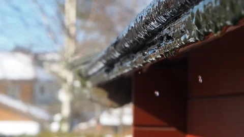 Snow melting off from rooftop Stock Footage 87269224