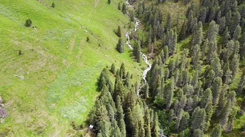 Snow melting into a small Mountain River - Aerial Flight Stock Footage 90648405