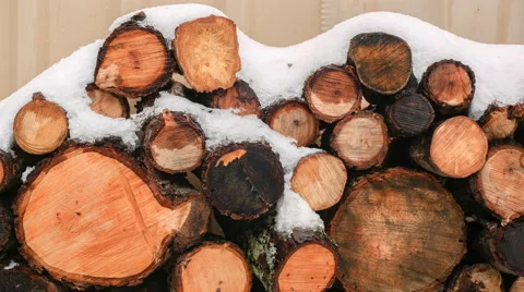 Snow melting on a wood stack Stock Footage 60723366