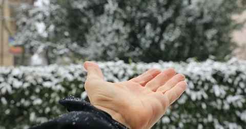 The snow melts on the hand Stock Footage 86517285