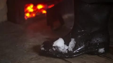 Snow melts on his boot timelapse Stock Footage 12587340