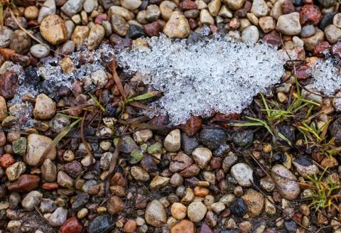 Snow melts on the rocks in spring Stock Photos
