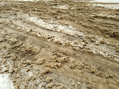 Snow mixed with mud on the road Stock Photos