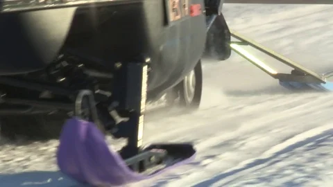 Snow mobile coming close and passing by Stock Footage 74690289