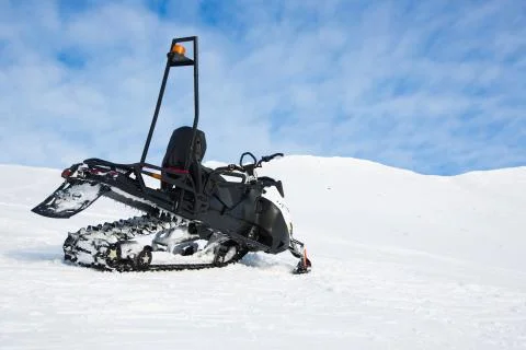 Snow Mobile in mountains Stock Photos