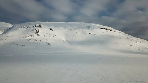 Snow mobile racing up and down a mountain Stock Footage 95199459