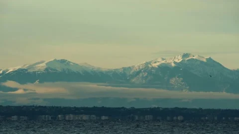 Snow on Mountain Olympus Calm Landscape with Clouds and Birds flying Stock Footage 146984836