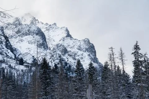 Snow mountain overcast sky Stock Photos