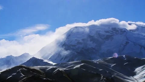 Snow mountain under blue sky Stock Footage 235107425