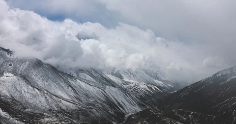 Snow Mountain Valley with Moving Storm clouds 4K Timelapse Nature Background Stock Footage 101236316