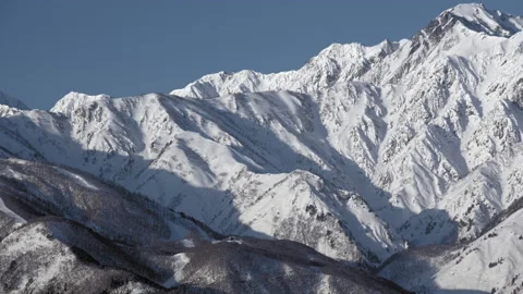 Snow mountain of winter view with blue sky is beautiful snow scenery in Japan. Video stock 149400907