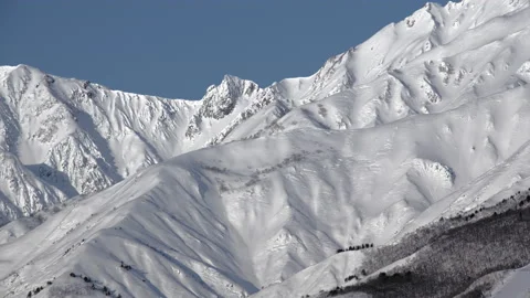 Snow mountain of winter view with blue sky is beautiful snow scenery in Japan. Stock Footage 149401098