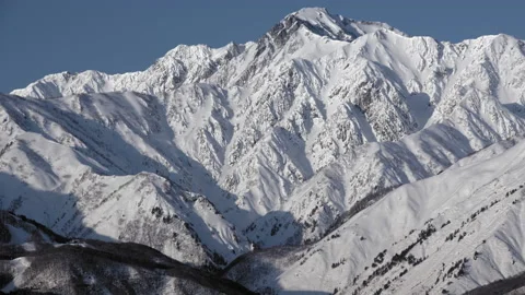 Snow mountain of winter view with blue sky is beautiful snow scenery in Japan. Stock Footage 149402317
