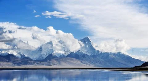 Snow mountains and skies in tibet Stock Photos