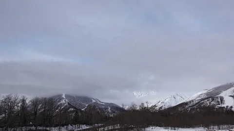 Snow mountains with clouds and mist is beautiful landscape by time-lapse Stock Footage 149923025