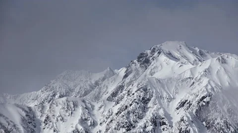 Snow mountains with clouds and mist is beautiful landscape by time-lapse Stock Footage 149973463