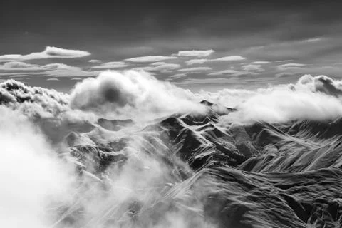 Snow mountains with clouds in evening Stock Photos