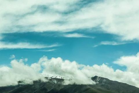 Snow mountains with clouds Stock Photos